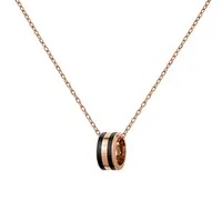 Daniel Wellington Stylový bronzový náhrdelník s kruhovým přívěskem Emalie DW00400305