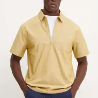 Bavlněné polo tričko Puma MMQ béžová barva, 626642