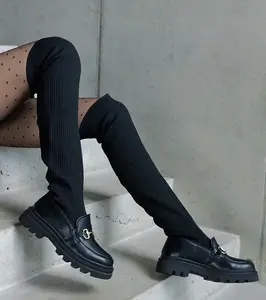 Gemre Black boots with a flexible upper on a flat heel Vrissa