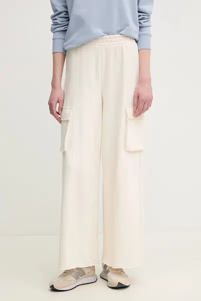 Bavlněné tepláky Dkny béžová barva, DJ5P3068