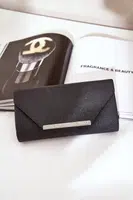 marka niezdefiniowana Elegantná Kabelka Klapka S Leskom Čierna Remiala