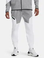 Šedo-biele športové tepláky Under Armour UA Unstoppable Flc Joggers