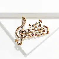 Alloy and Glass Rhinestone Musical Note Brooch
