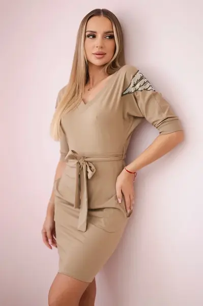 Dress with wings on camel shoulders