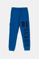 Dětské bavlněné tepláky Guess modrá barva, s potiskem, L5YQ13 KAD74