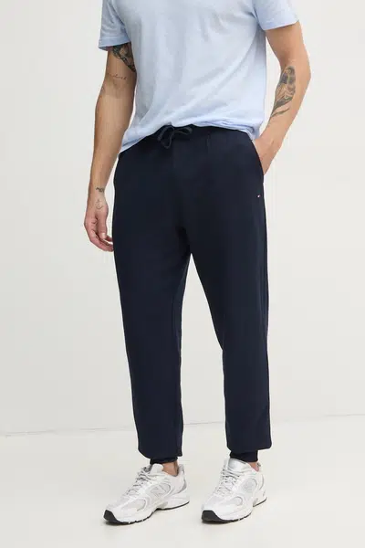 Bavlněné tepláky Tommy Hilfiger tmavomodrá barva, MW0MW37236