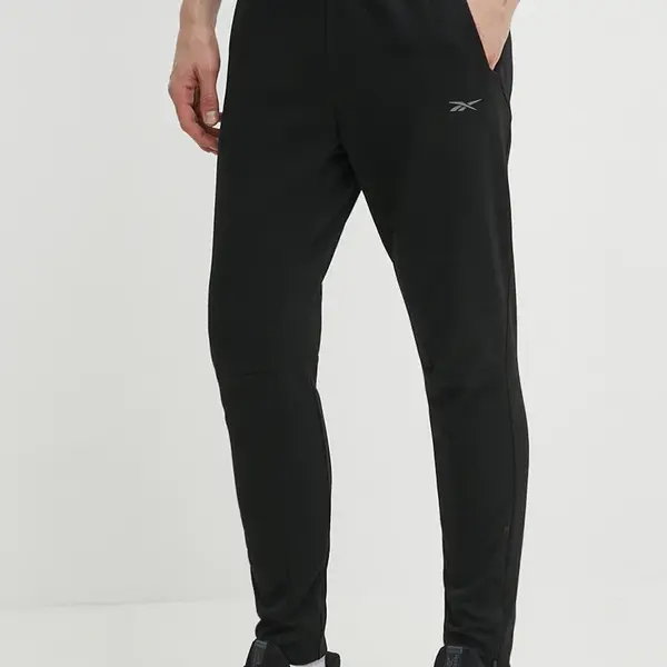Tréninkové kalhoty Reebok Strength černá barva, hladké, 100075596