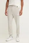 Tepláky adidas Essentials pánské, béžová barva, s aplikací, JE6317