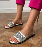 Gemre White flip-flops adorned with Zurab crystals