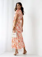 Resti Patterned Women's midi dress with short sleeves, a wrap neckline, and a belt