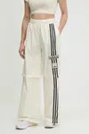Tepláky adidas Originals Woven Trackpant dámské, béžová barva, s aplikací, JD0087
