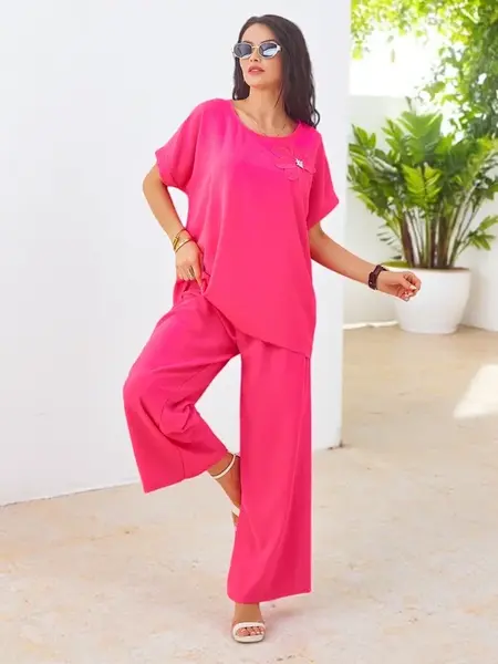 Resti Women's set with short sleeves, decorative flower, and wide trousers