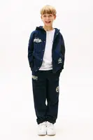 Tepláky Tommy Hilfiger tmavomodrá barva, KB0KB09700