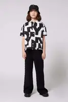 Dětské kalhoty Dkny černá barva, hladké, D62276