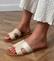 Gemre Beige flat-soled embossed sandals Sarini