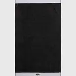Bavlněný ručník Lacoste L Casual Bitume 70 x 140 cm