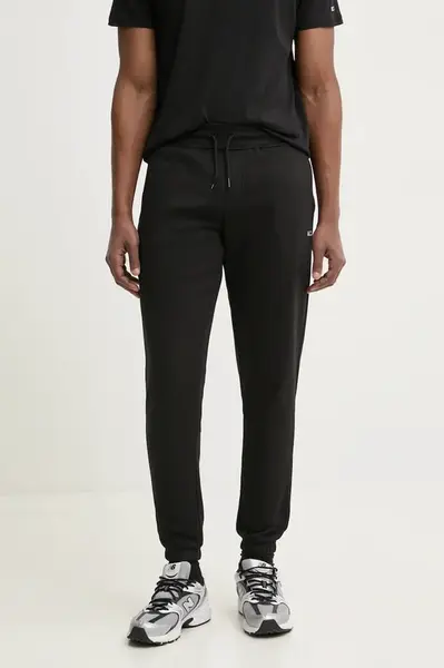 Tepláky Tommy Jeans černá barva, hladké, DM0DM20473