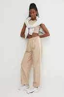 Tepláky adidas Originals béžová barva, s aplikací, IS1973