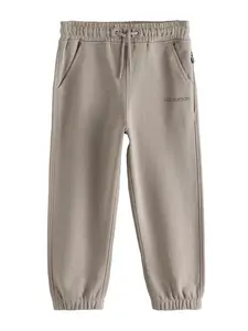 Next Nohavice  brokátová