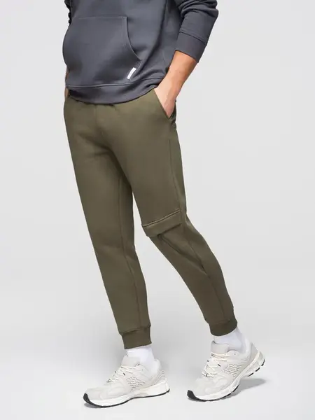 Ombre Men's sweatpants with stitching and leg zipper - olive