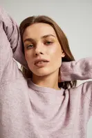 Pink sweater with a round neckline and waist tie