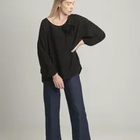 Black oversize blouse with a decorative flower